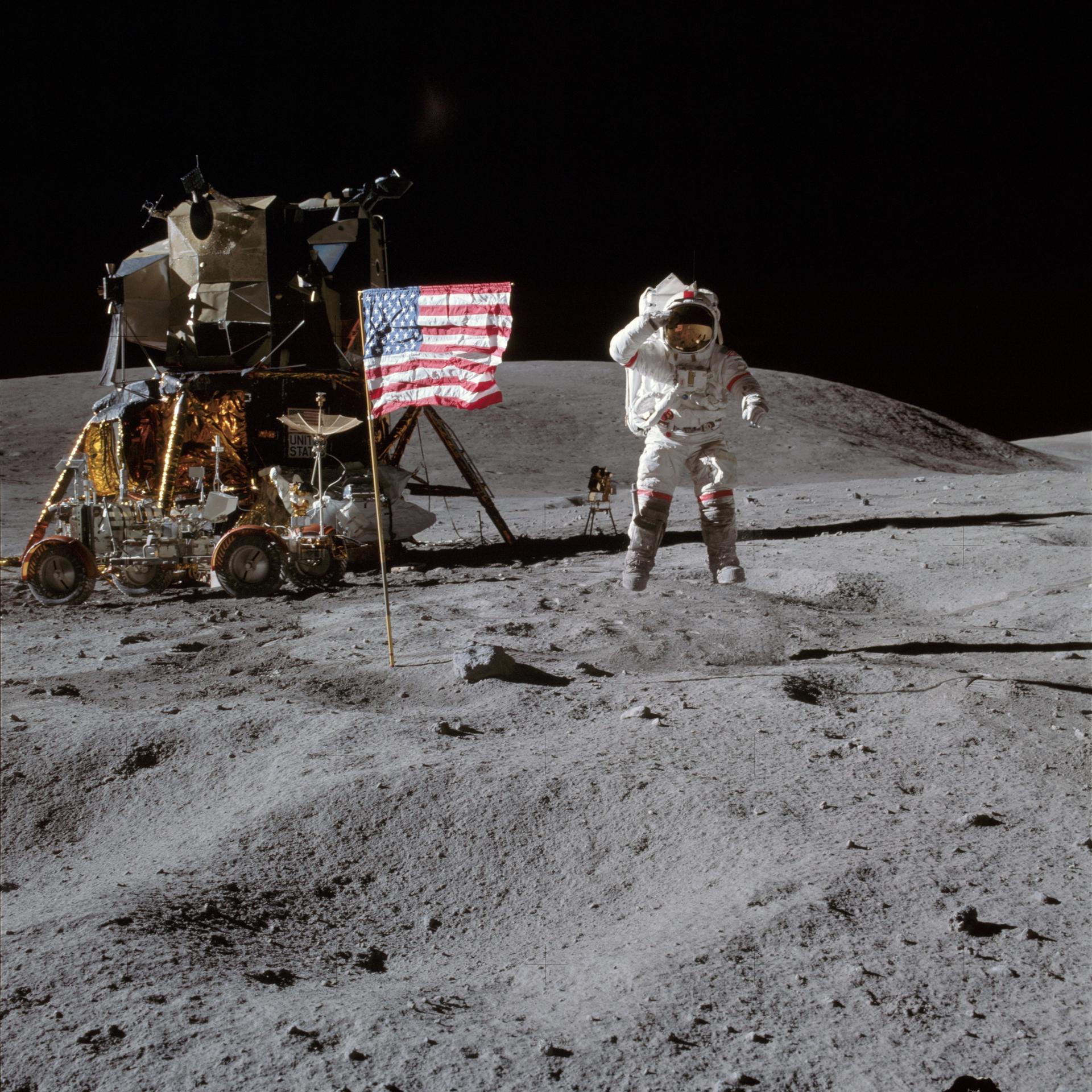 US astronaut John Young, commander of the Apollo 16 lunar landing mission, salutes the flag at the Descartes lunar site, 21 April 1972, NASA.