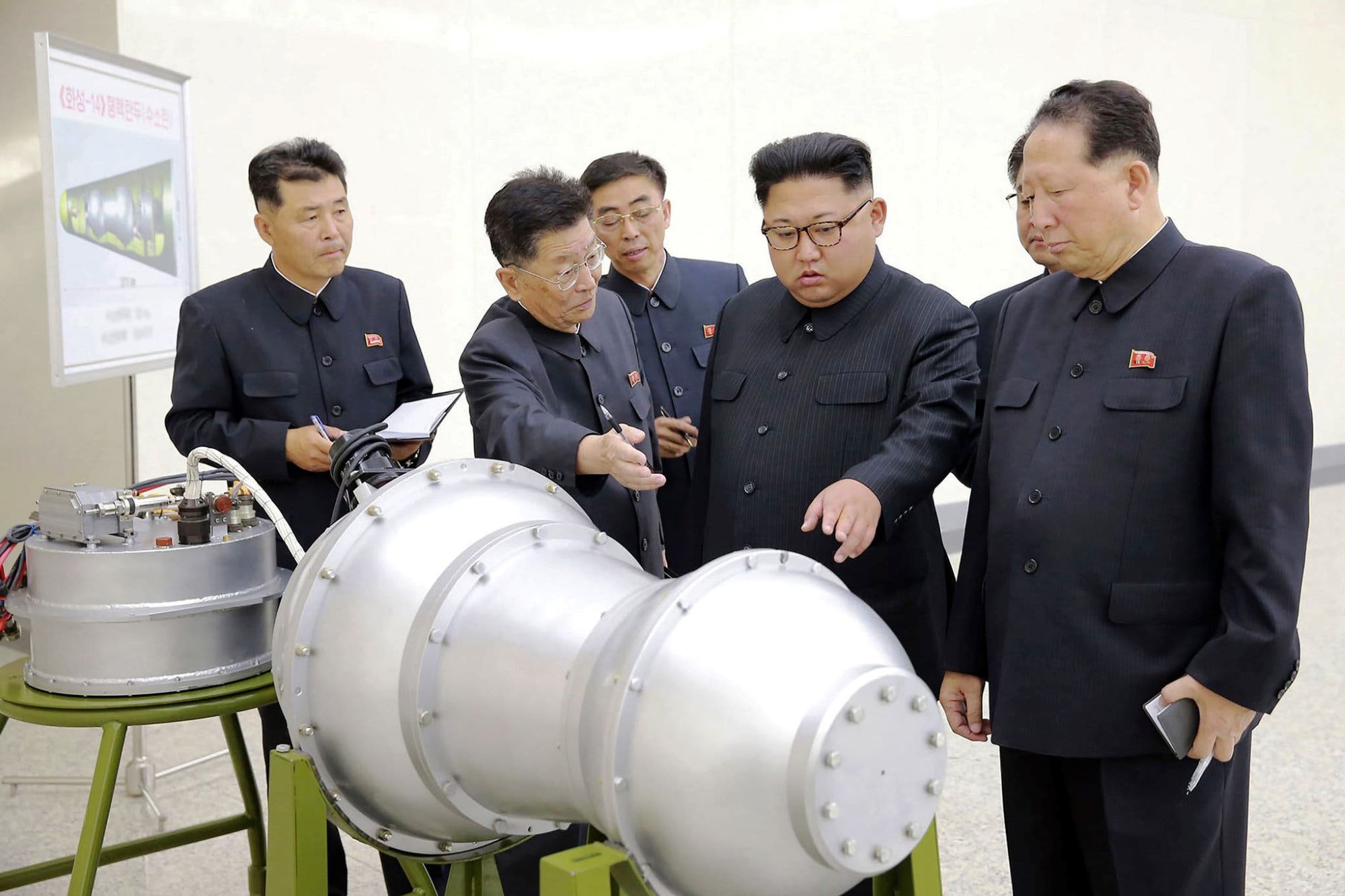 Photo of North Korean leader Kim Jong-un being shown a device claimed to be a thermonuclear weapon small enough to fit into an ICBM. Photo: Korean Central News Agency, September 3rd 2017.