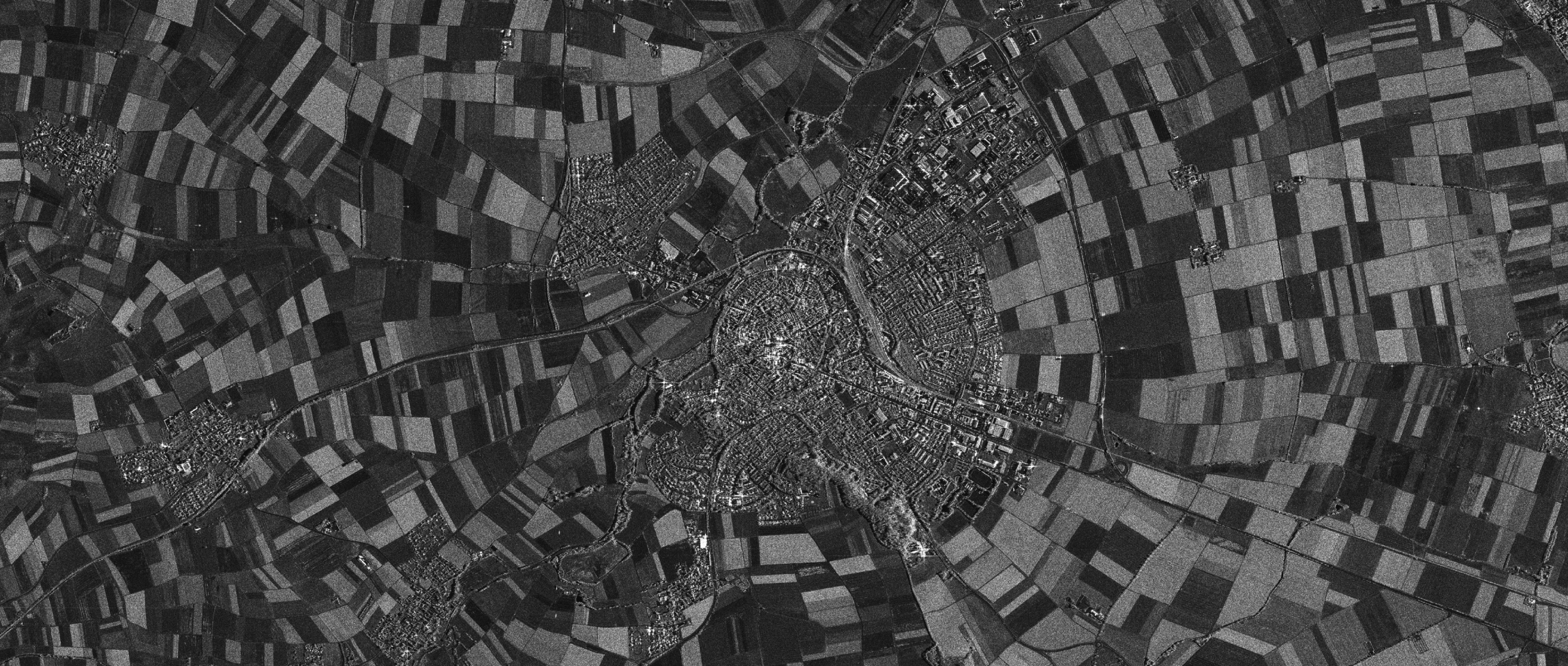 Synthetic Aperture Radar (SAR) satellite imagery of Nördlingen, Germany. Image taken by the TerraSAR-X satellite (1-m resolution) operated by DLR, 2007. Source: Wikimedia.