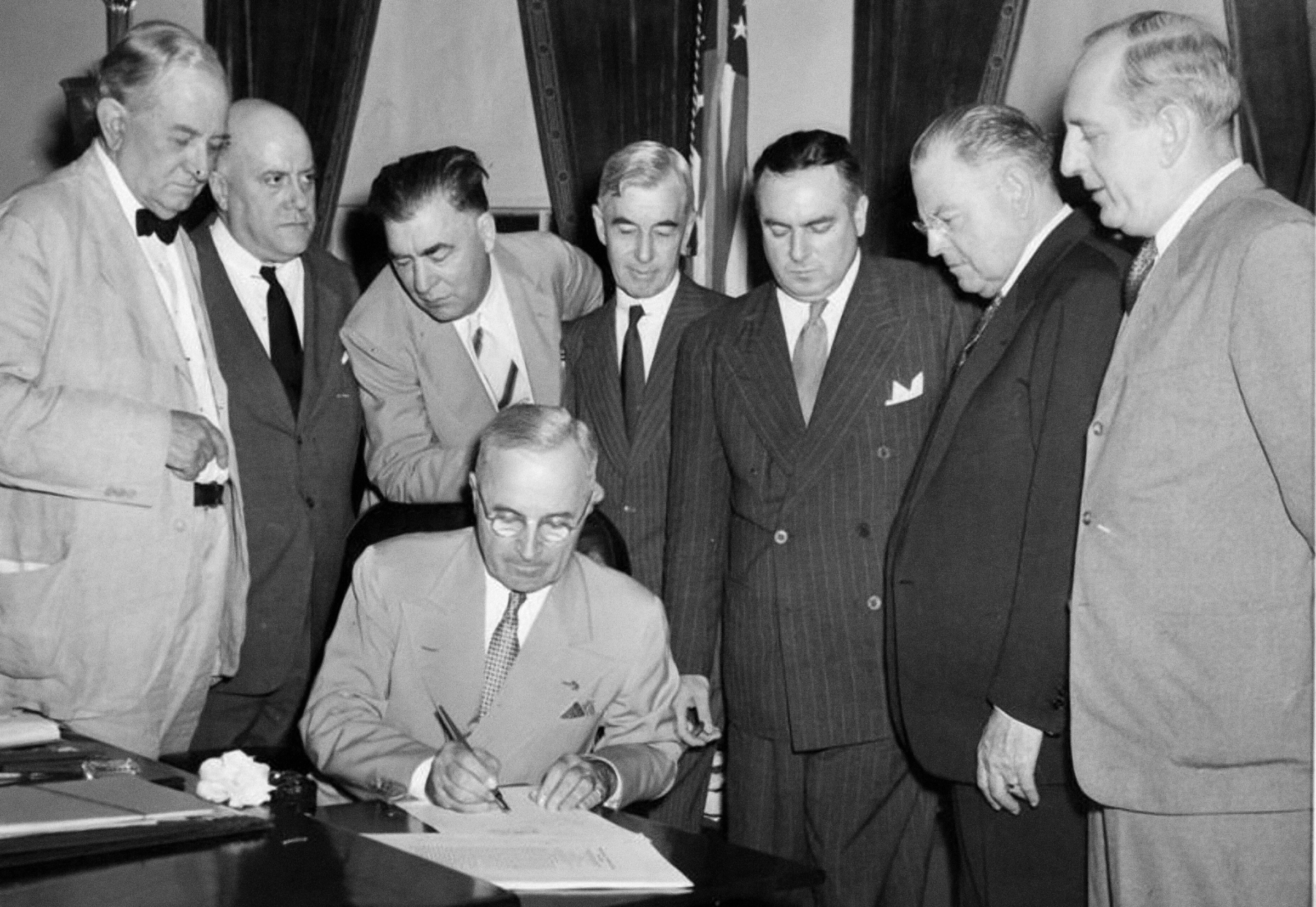 President Harry Truman signs the Atomic Energy Act of 1946 on August 1, 1946. Photo courtesy of the U.S. Department of Energy, flickr.com.