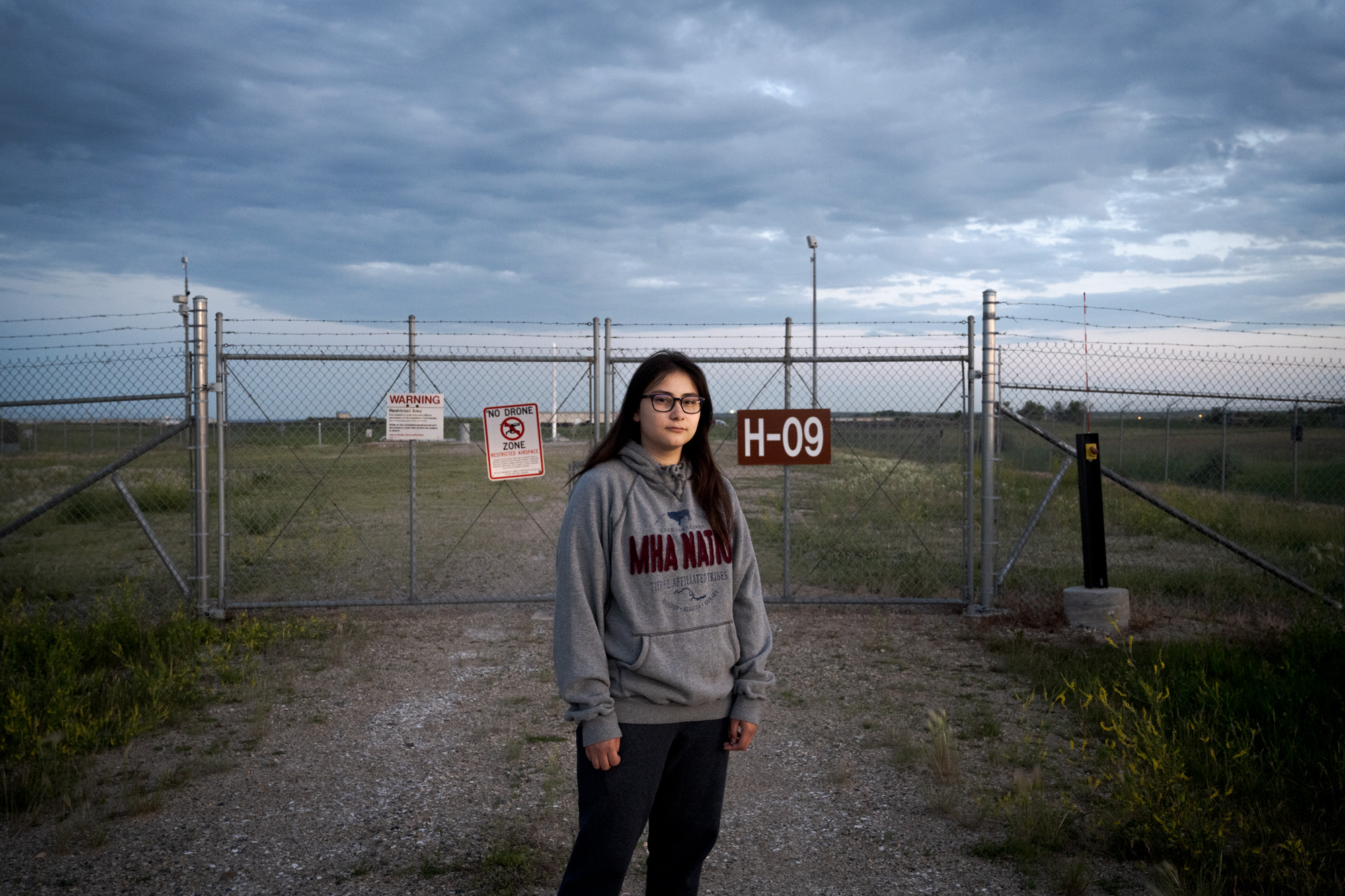 Ella Weber '25 stands in front of a US nuclear missile silo on her tribal land in North Dakota