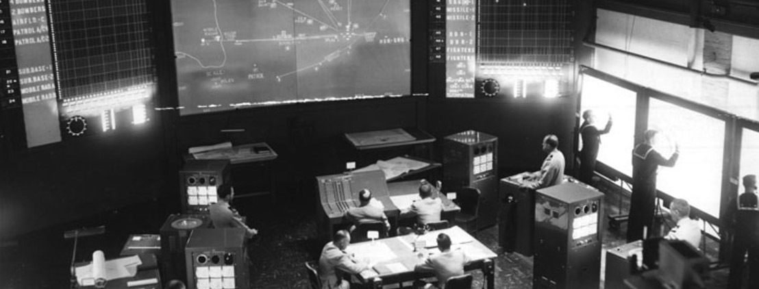 A wargame at the US Naval War College in 1958, using the newly installed Navy Electronic Warfare Simulator. Credit: US Naval War College.